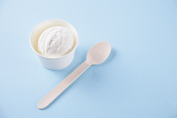 Vanilla ice cream on the blue background