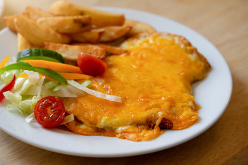 Selective focus of C with chips and mixed vegetable salad, Homemade Permo, English menu in Middlesbrough, England