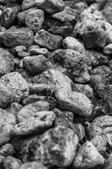 pile of stones black and white background