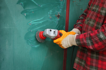 Old metal door repairing, rust and paint cleaning