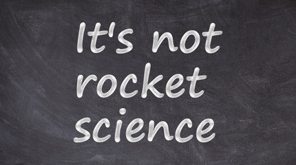 Obraz premium It's not rocket science written on blackboard