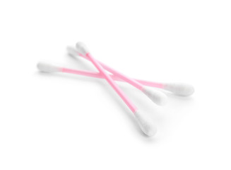 Pink plastic cotton swabs on white background