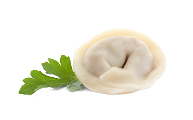 Fresh boiled dumpling and parsley leaf on white background