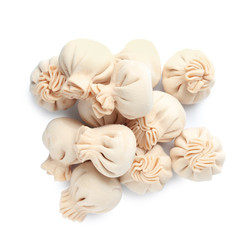 Pile of raw dumplings on white background, top view