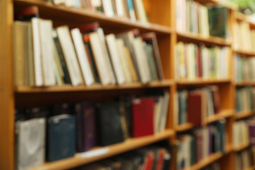 Blurred view of cabinets with books in library