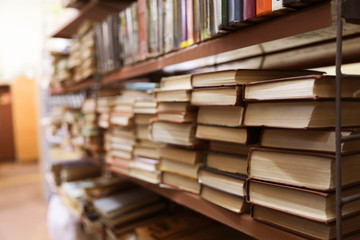 Shelving unit with collection of books in library