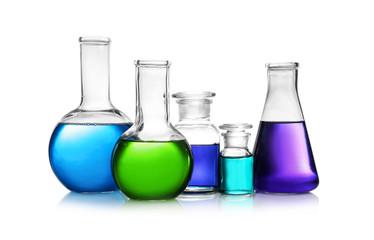 Set of different lab glassware with color liquid isolated on white