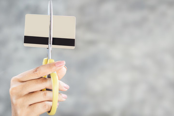 woman hand cutting credit card by scissors  with copy space, debt free concept 
