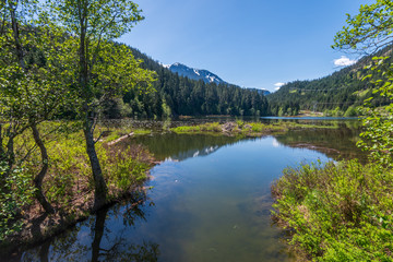 Fototapeta na wymiar Mountain Lake with Blue Sky in British Columbia, Canada.