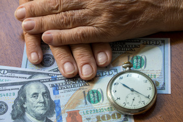 Elderly Retired Woman Hand, Money and Time Concept. Retirement Concept