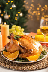 Fototapeta na wymiar Delicious roasted turkey with garnish on dinner table