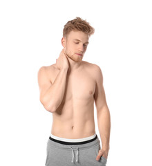 Fototapeta premium Portrait of young man with slim body on white background