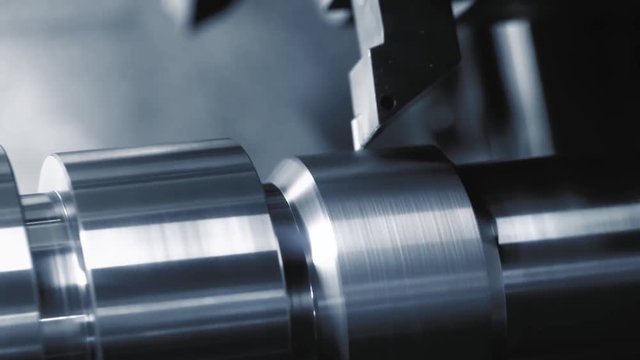 Metalworking CNC lathe milling machine. Cutting metal modern processing technology.