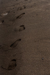 footprints in black sand 