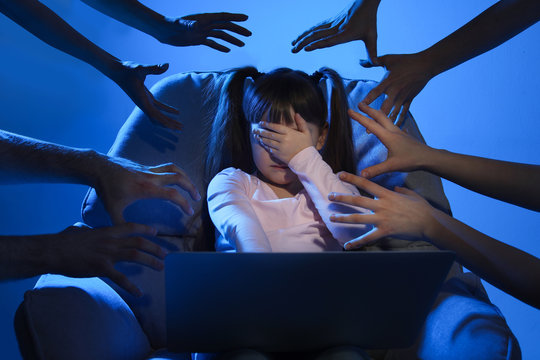 Strangers reaching frightened little child with laptop on color background. Cyber danger