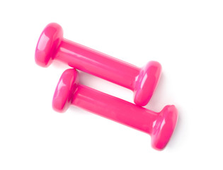 Color dumbbells on white background. Home fitness, top view