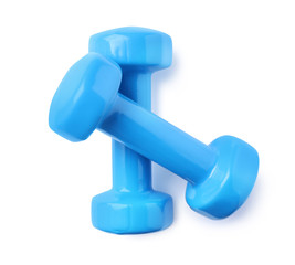 Color dumbbells on white background. Home fitness