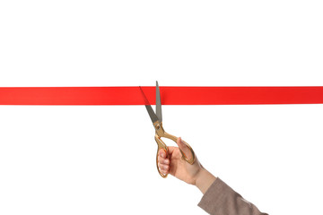 Woman in office suit cutting red ribbon isolated on white, closeup