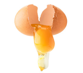 Chicken egg broken in half, follows yolk and protein on a white, isolated. - obrazy, fototapety, plakaty