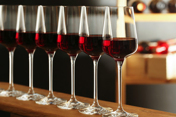 Glasses of red wine in cellar. Expensive drink