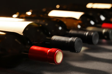 Bottles of different wines, closeup. Expensive collection