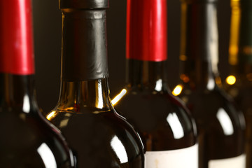 Bottles of different wines, closeup. Expensive collection