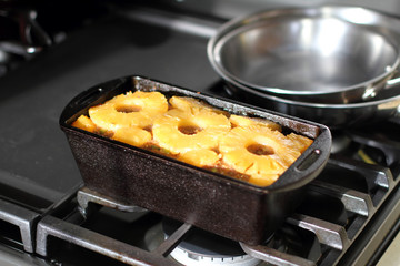 Hawaiian style meatloaf with pineapple in a cast iron loaf pan.