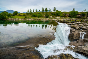 Montenegro, River cijevna waterfall forms beautiful niagara falls near podgorica in green landscape