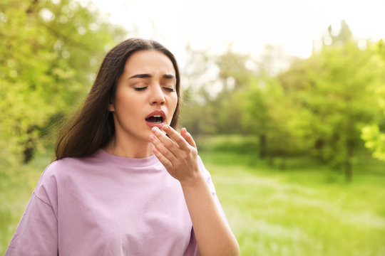 Young Woman Suffering From Seasonal Allergy Outdoors, Space For Text