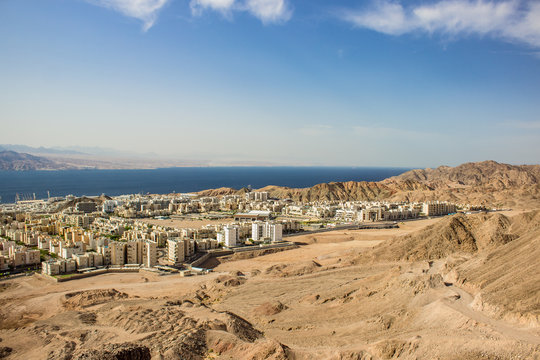 aerial photography of beautiful Eastern city on gulf of Aqaba Red sea bay sunny colorful scenic landscape place touristic destination for vacation in summer season time 