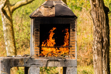 fire in an outdoor brick barbecue