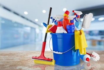 Plastic bottles, cleaning sponge and gloves  on background