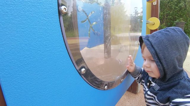 Boy baby in the porthole