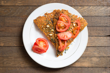 Homemade vegan sandwich with dried bread and tomatoes