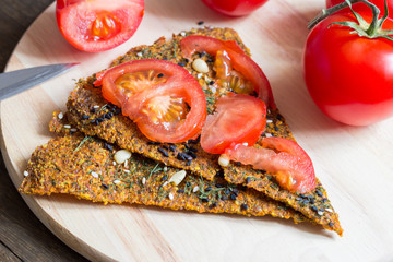 Raw Vegan Bread with tomato slices on it