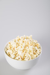 Bowl with popcorn. Isolated on white background.