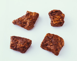 Fried sauteed beef tenderlion cubes isolated on white background