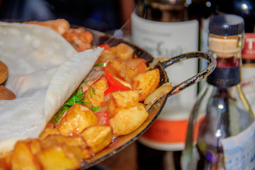 Baked potatoes in a cauldron with meat. Meat dish. Baked Potato.