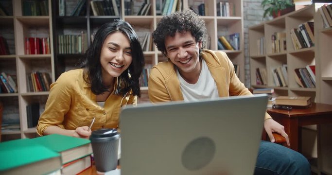 Asian students having a video conference with their international friends or distant relatives, expressively gesturing and talking close up 4k