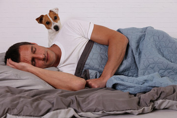Dog waking up owner. Let's go for a walk. Pet at home concept