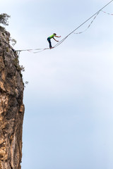 Highliner balances over the abyss.