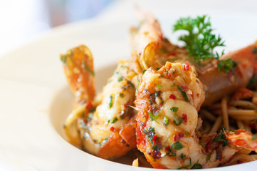 Favorite food, Spaghetti shrimp chilli sauce  food Asian style in modern white plate.