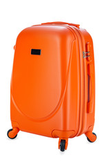 Travel orange suitcase isolated on white background. Close-up.