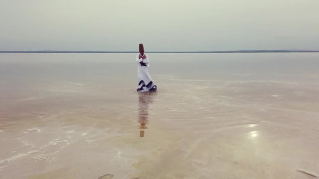sunset and whirling at the sea, sufi. sufi whirling (Turkish: Semazen) is a form of Sama or physically active meditation which originated among Sufis. 4k