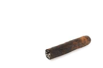 Cut and burned cigar on white background, world no tobacco day. Premium cigars from Havana, Cuba.