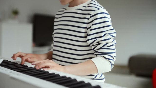 Handsom teenager has pieano lesson