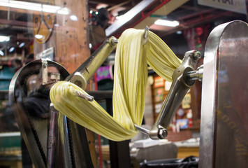 Taffy being stretched by machine