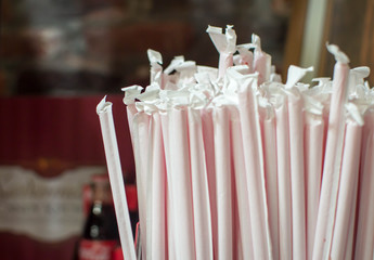 A bunch of wrapped red straws