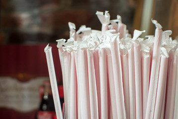 A bunch of wrapped red straws