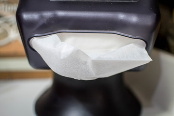 Front of black napkin dispenser